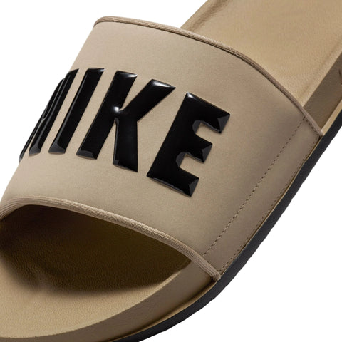 Close up image of the forefoot strap of a Nike Offcourt Slides in Khaki Black Black