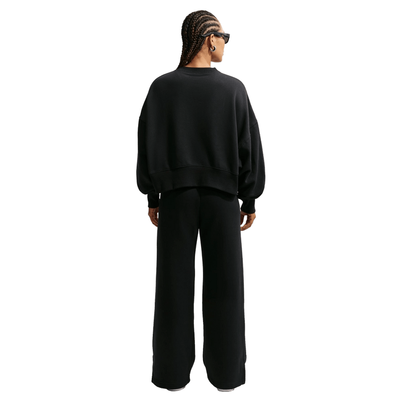 Back view of the Nike Phoenix Fleece Sweatpants in Black colourway, women model