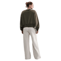 Back view of the Nike Phoenix Fleece Sweatpants in Light Orewood Brown colourway, women model