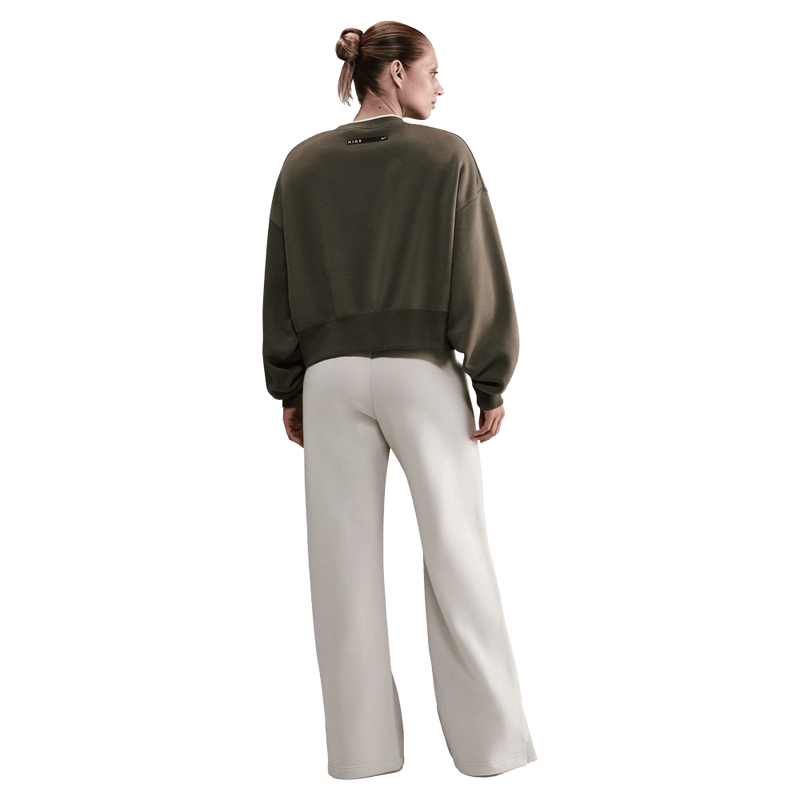 Back view of the Nike Phoenix Fleece Sweatpants in Light Orewood Brown colourway, women model