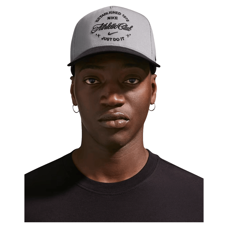 Main view of the Nike Rise Cap in Smoke Grey colourway, unisex model