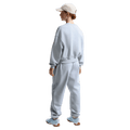 Back view of the Nike  Sportswear Club Fleece Crew Neck in Ghost colourway, kids model