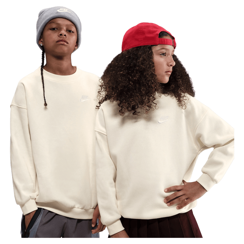 Main view of the Nike  Sportswear Club Fleece Oversized Sweatshirt in Soft Pearl colourway, kids model