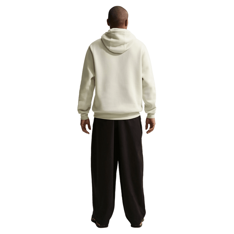 Back view of the Nike Sportswear Club Hoodie in Light Khaki colourway, unisex model