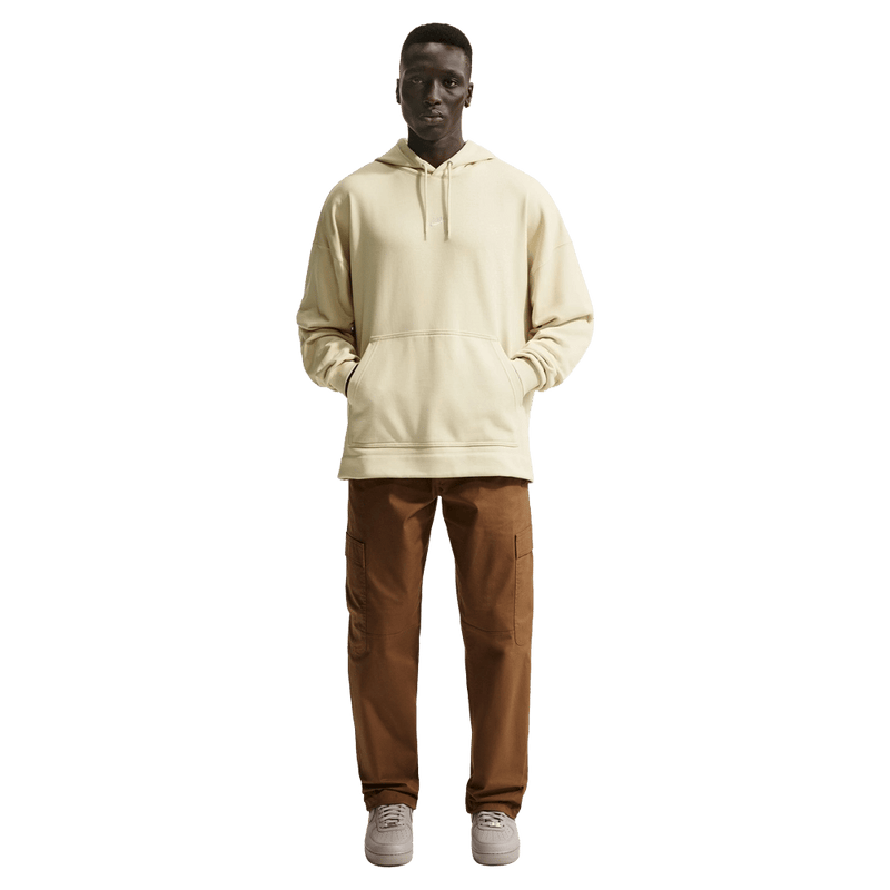 Front view of the Nike Sportswear Club Hoodie in Light Khaki and white colourway, unisex model