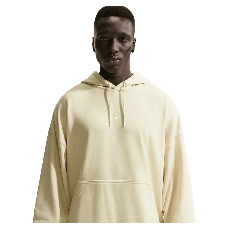 Main view of the Nike Sportswear Club Hoodie in Light Khaki and white colourway, unisex model