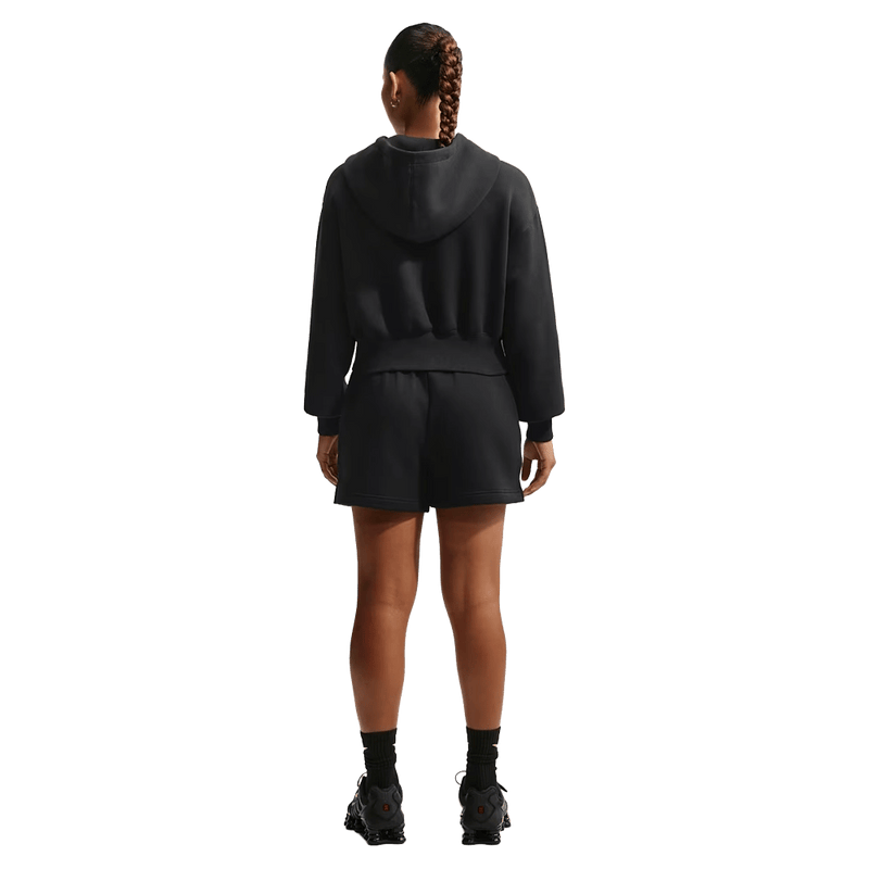 Back view of the Nike Sportswear Phoenix Fleece Full-Zip Cropped Hoodie in Black colourway, women model