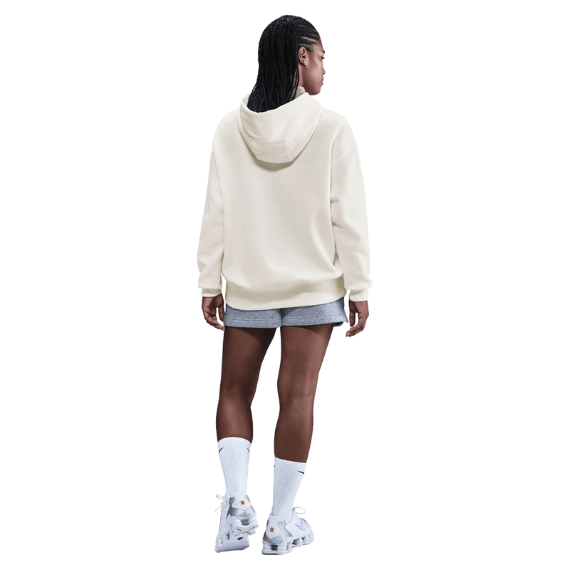 Back view of the Nike Sportswear Phoenix Fleece Oversized Hoodie in Sail and Black colourway, unisex model
