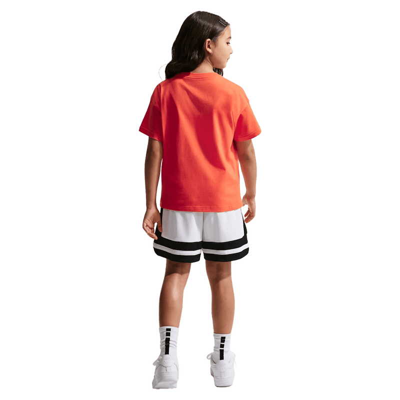 Back view of the Nike Sportswear Tee in Turf Orange colourway, kids model