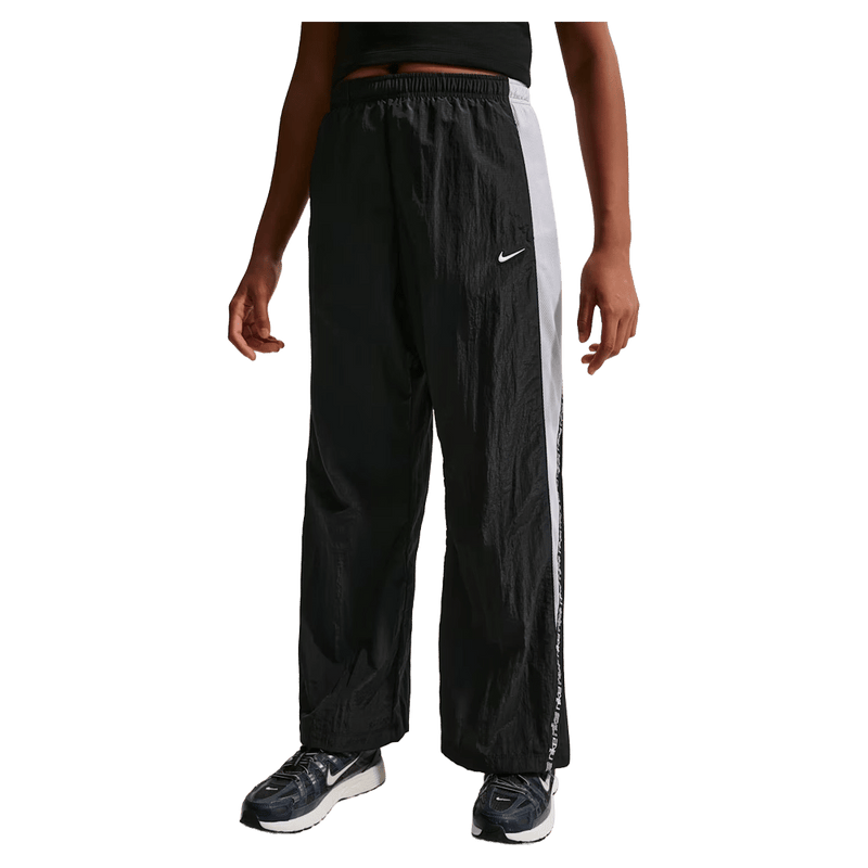 Main view of the Nike Sportwear Pants in Black colourway, kids model