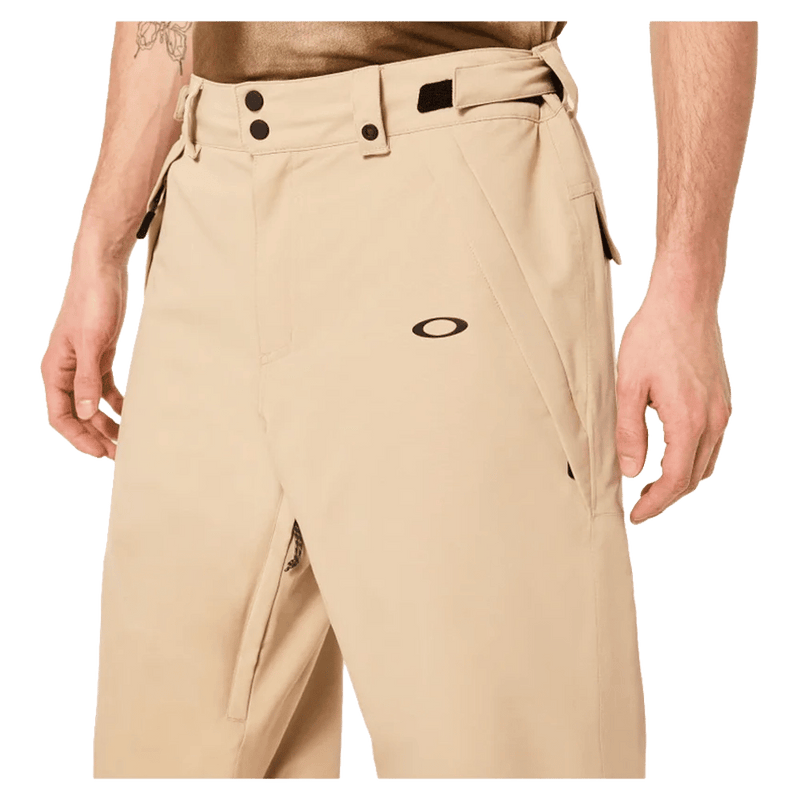 Detail view of the Oakley Best Cedar Rc Insulated Ski Pants in Pebble colourway, mens's model