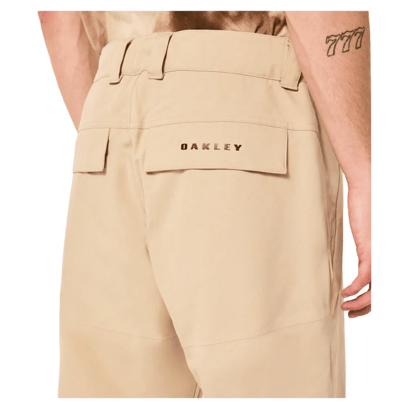 Detail view of the Oakley Best Cedar Rc Insulated Ski Pants in Pebble colourway, mens's model