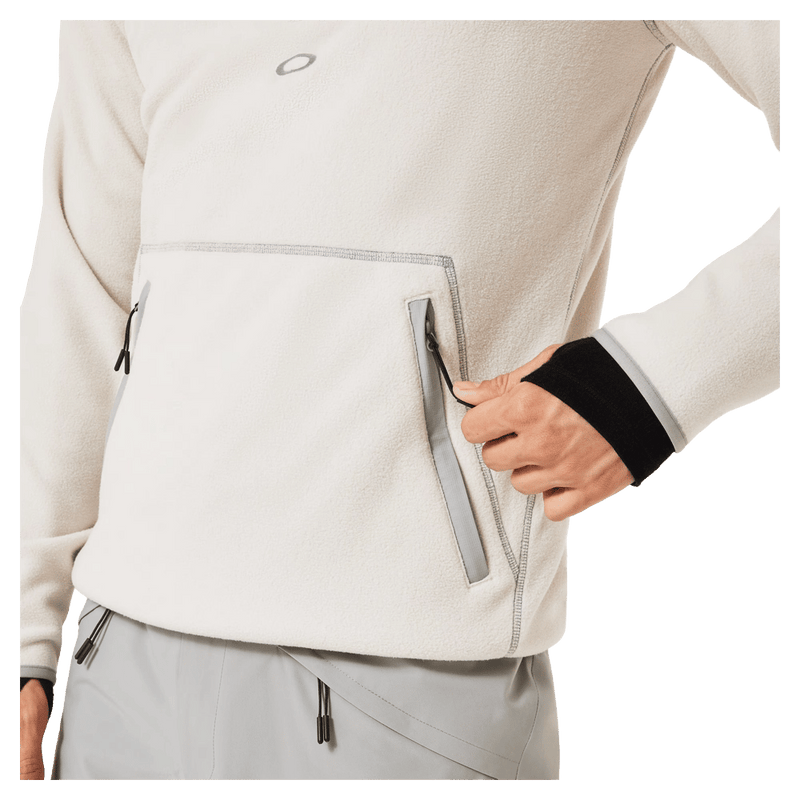 Pocket view of the Oakley Butter Tech Fleece in Mist and Cement colourway, men's model
