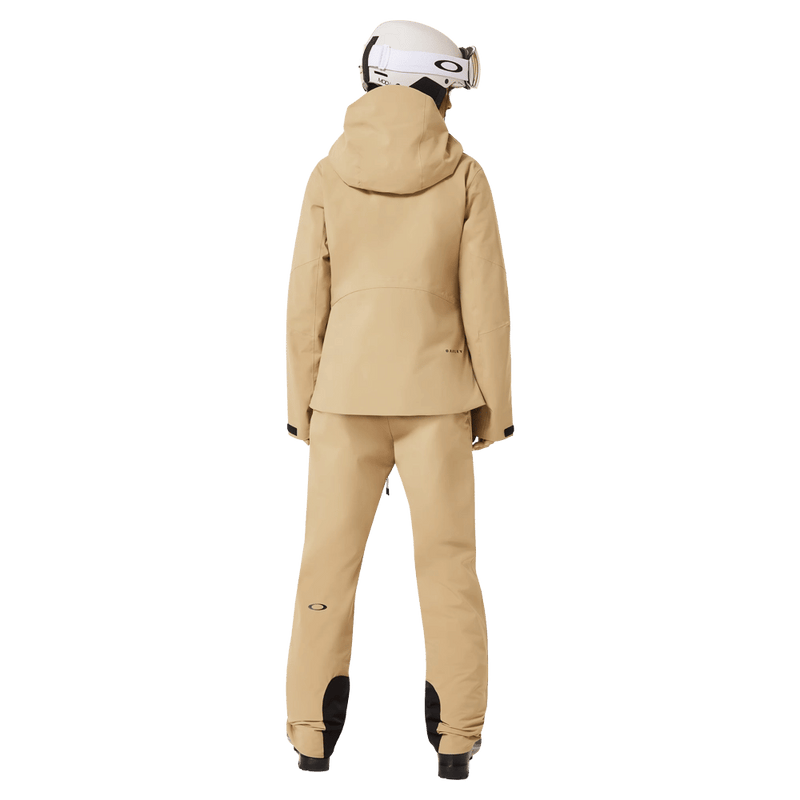 Back view of the Oakley Canopy Insulated Jacket in Pebble colourway, women model