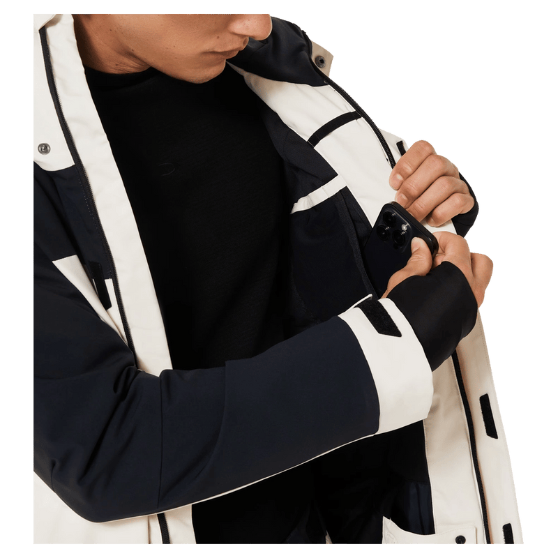 Inside pocket view of the Oakley Tnp Tbt Insulated Ski Jacket in Mist colourway, unisex's model