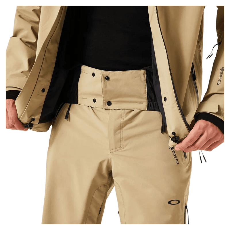 Powder skirt view of the Oakley Unbound Gore-Tex Shell 2.0 Ski Jacket in Pebble colourway, men's model