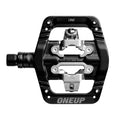Main view of the OneUp Clip Pedals in Black colourway, unisex's model.