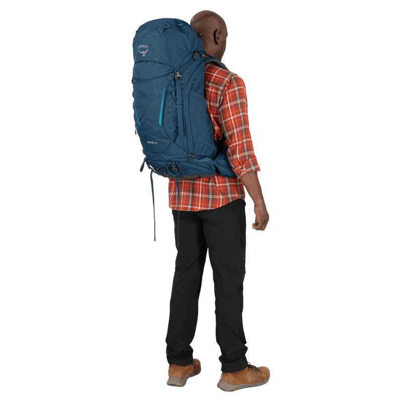 Carried view of the Osprey Kestrel 48 Hydration Bag in Blue colourway, men model