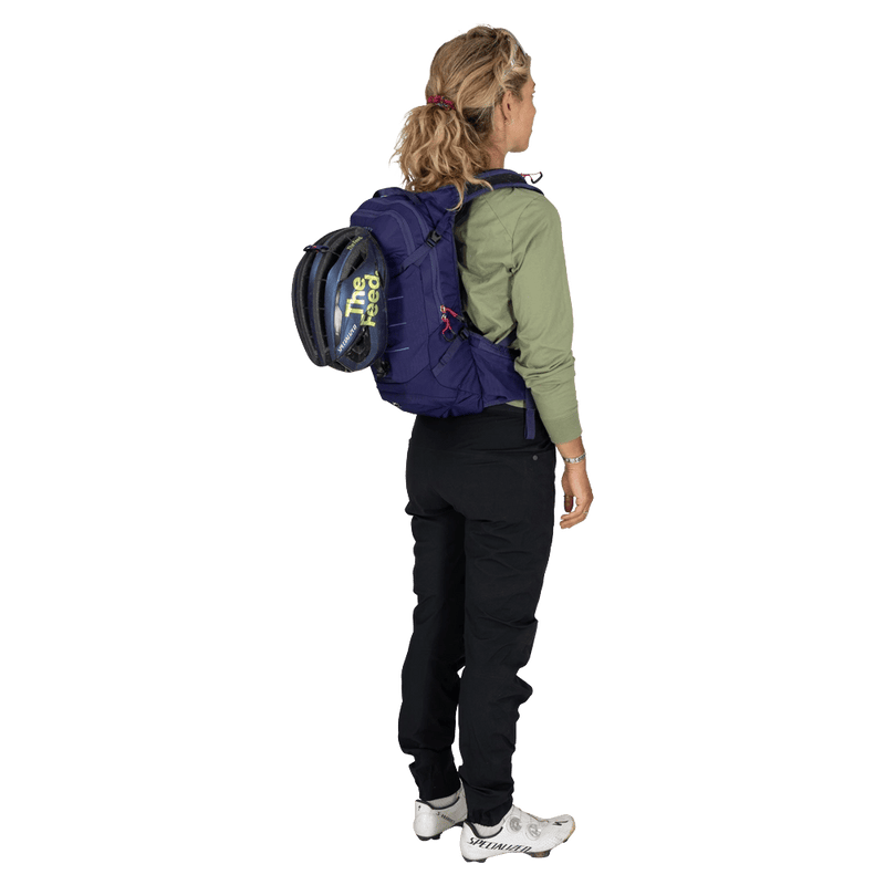 Carried view of the Osprey Raven 10 Hydration Bag in Deep Fig colourway, women model