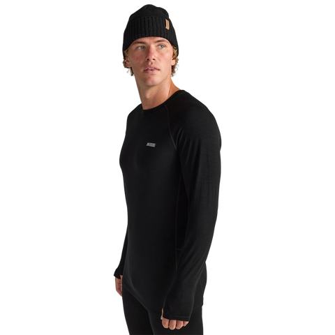 Side view of men wearing Oyuki 2026 Merino Thermal Longsleeve in black