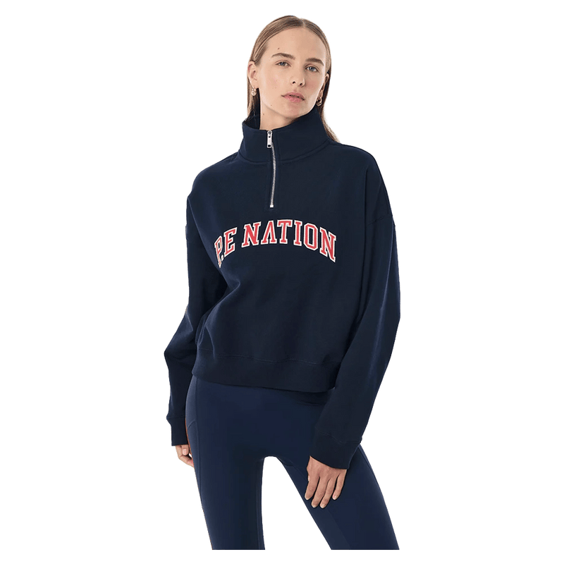 Front view of the P.E Nation Legacy Quarter Zip Jumper in Dark Navy colourway, women model