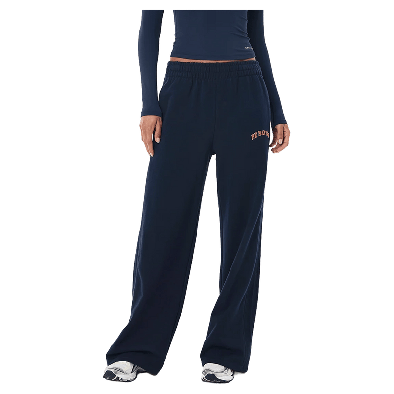 Front view of the P.E Nation Legacy Trackpant in Dark Navy colourway, women model