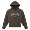 Main view of the P.E Nation Core Hoodie in Dark Olive colourway, women model