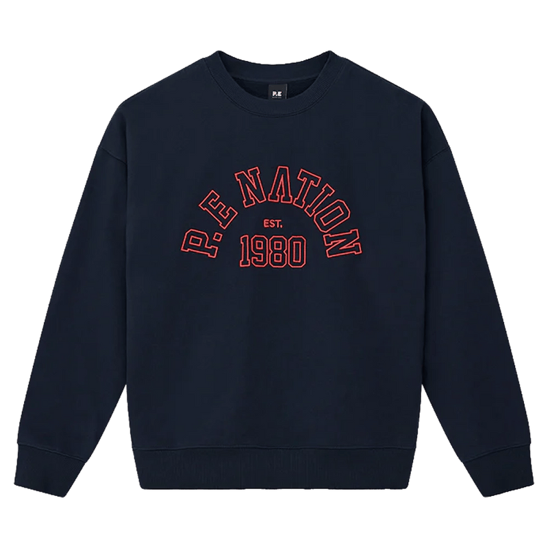 Main view of the P.E Nation Established Jumper in Dark Navy colourway, women model