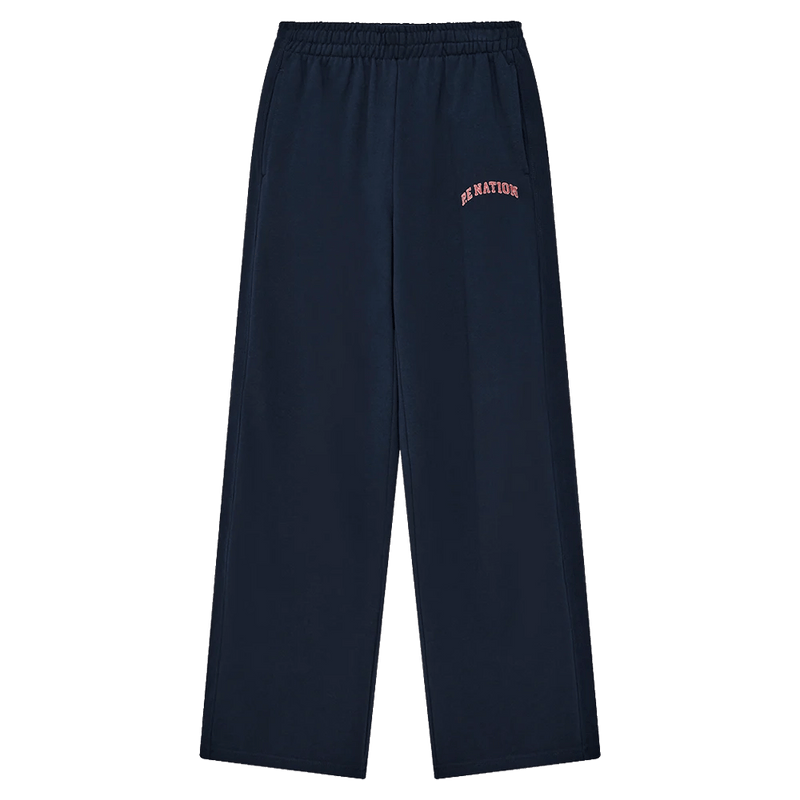 Main view of the P.E Nation Legacy Trackpant in Dark Navy colourway, women model