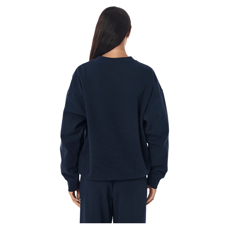 Back view of the P.E Nation Established Jumper in Dark Navy colourway, women model