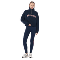 Full-body view of the P.E Nation Legacy Quarter Zip Jumper in Dark Navy colourway, women model
