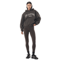 Full-body view of the P.E Nation Core Hoodie in Dark Olive colourway, women model
