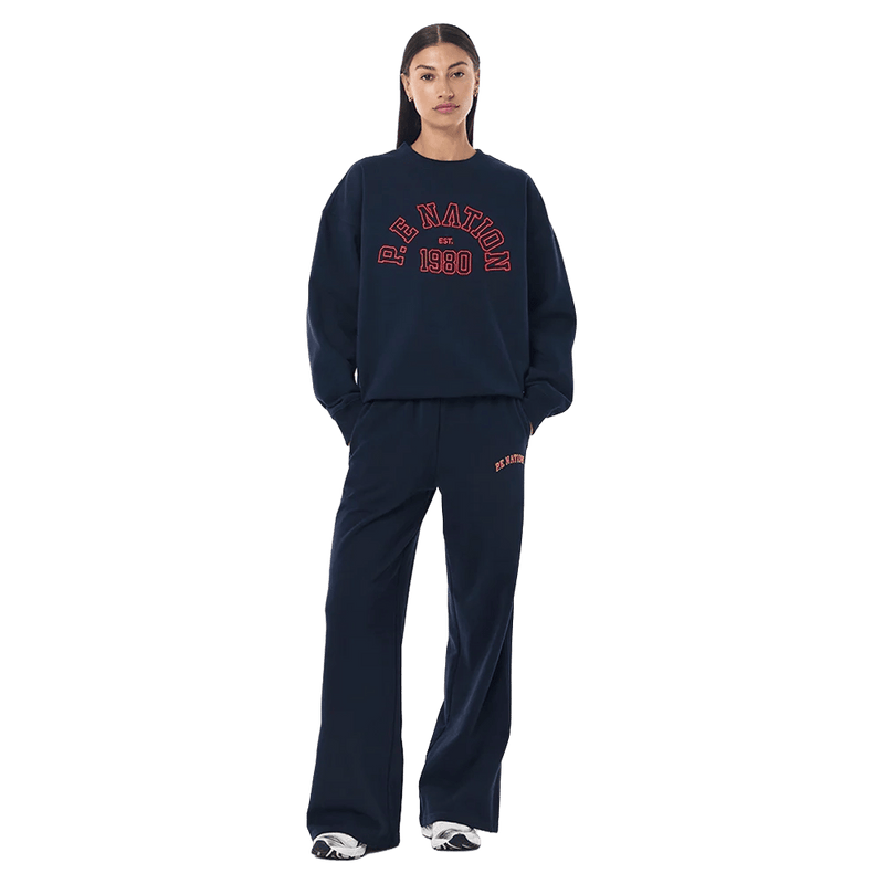 Full-body view of the P.E Nation Established Jumper in Dark Navy colourway, women model