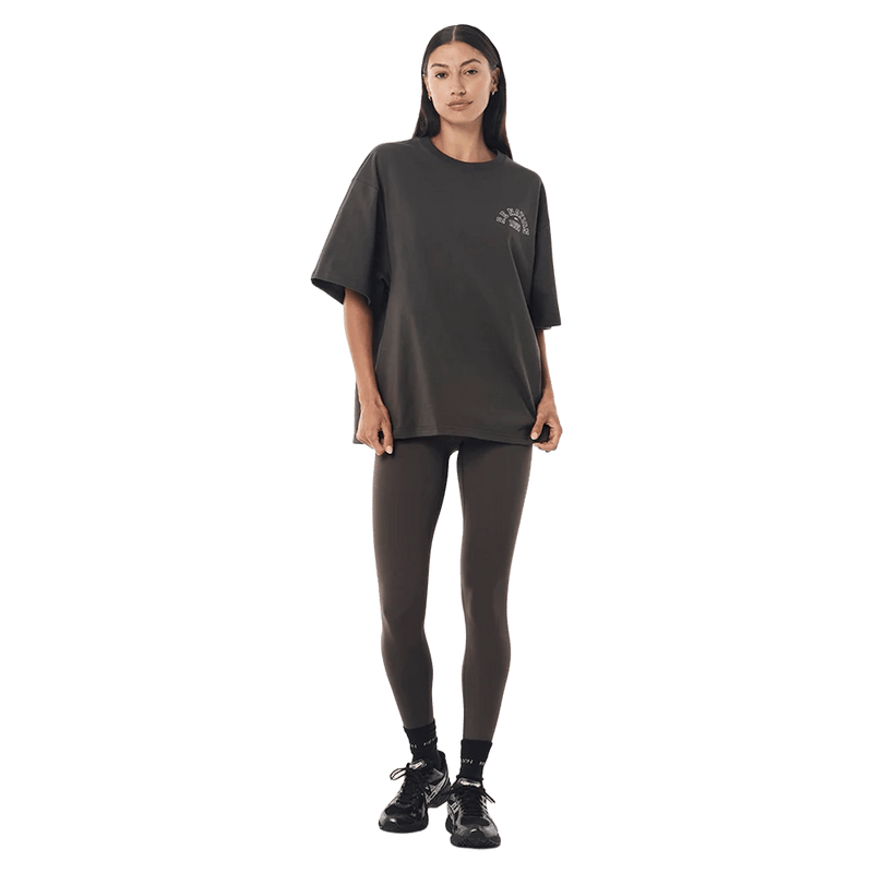 Full-body view of the P.E Nation Established Tee in Dark Olive colourway, women model
