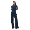 Full-body view of the P.E Nation Legacy Trackpant in Dark Navy colourway, women model