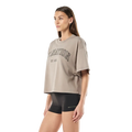 Side view of the P.E Nation Area Tee in Oatmeal colourway, women's model