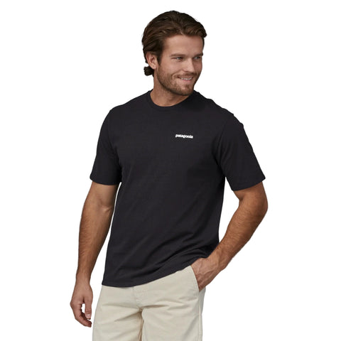 Front view of men wearing Patagonia P-6 Logo Responsibili Tee in black colourway
