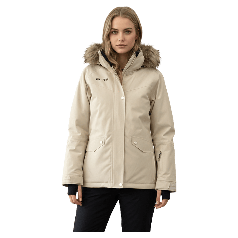 Beige Pure Aspen Ski Jacket for women featuring a faux fur hood, front pockets, and black wrist gaiters.