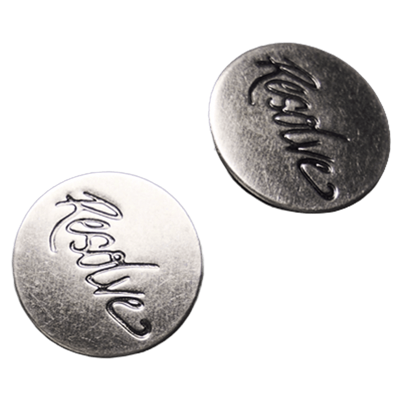 Two silver metallic buttons with embossed Resolve script logo for Sprinter Baggy cargo Ski Pants.