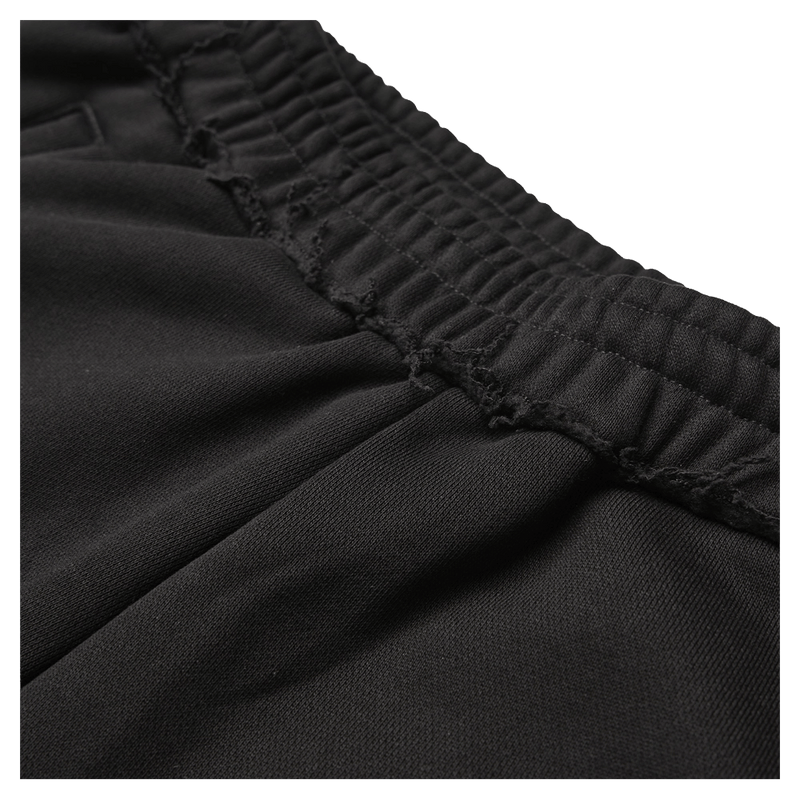 Black Resolve Daily Sweatpants close-up of elasticated waistband with raw-edge distressed detailing.
