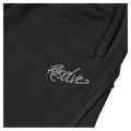 Close-up of black Resolve Daily Sweatpants with white embroidered script logo and side pocket.