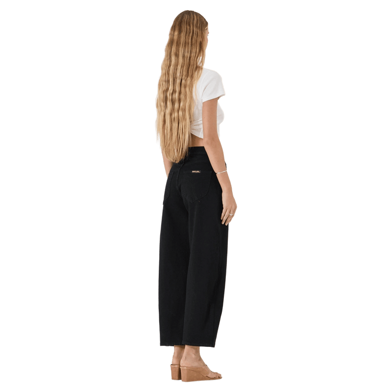 Side view of Rollas Gig Barrel Jeans - Womens in colour Jet Black.