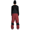 Rear, on-body image of the Rain Gore-Tex Bib Snowboard Pants from Volcom in Burnt Red. Featuring belt loops, Zip Tech pant to jacket interface, side pockets with zip closure and contrast black through upper bib and behind knees.