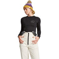Rojo women's white high rise softshell ski pants with black suspenders and front zipper.