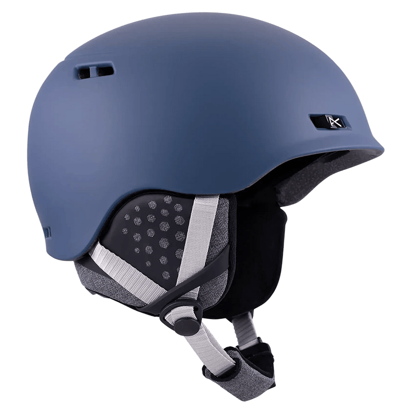 Matte navy blue Anon Rodan helmet with grey ear pads and adjustable chin strap, side profile view.
