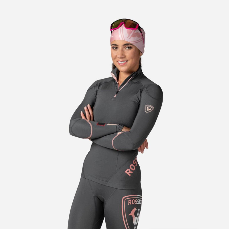 Tight-fit grey Rossignol Infini Compression Race Top with high neck and grey graphic details on the sleeves. Shown on model