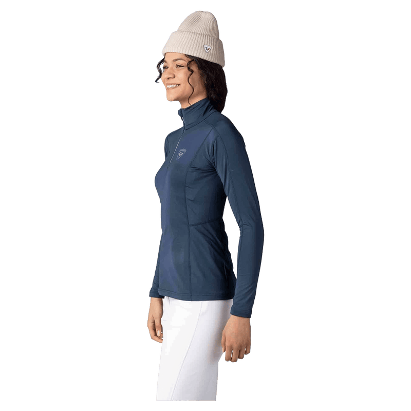 Side view of the Rossignol CLASSIQUE Half ZIP Baselayer in DARK NAVY colourway, women model