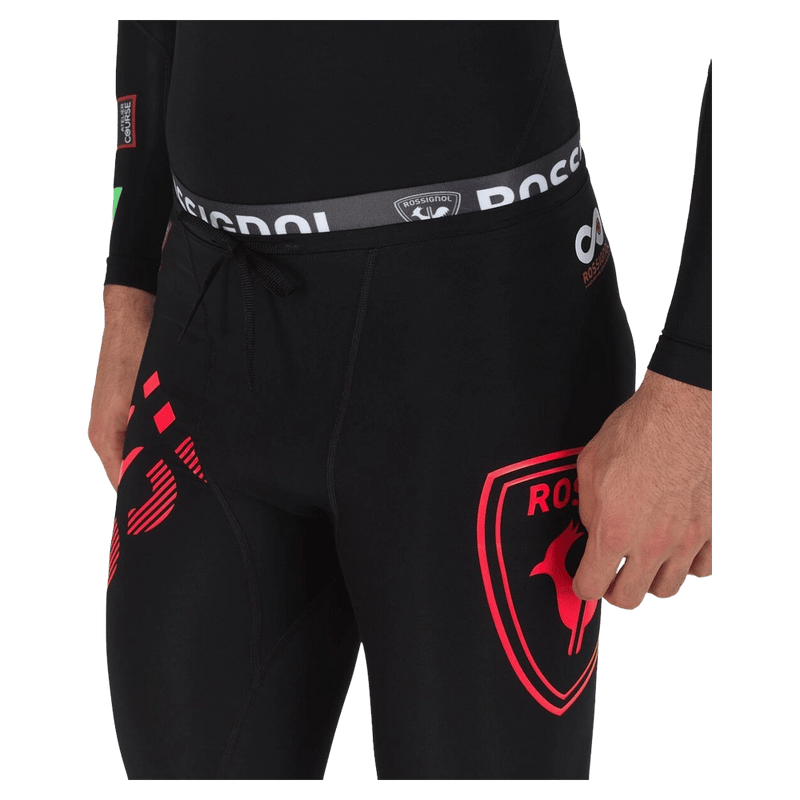 Waist view of the Rossignol Infini Compression Race Tights in Neon Red colourway, men model