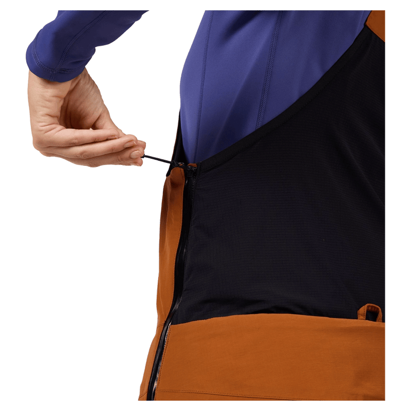 Detail view of the Rossignol Outerlimits Insulated Bib in DEEP CARAMEL colourway, women model