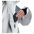 Media pocket view of the Rossignol VELIKA INSULATED Jacket in WHITE colourway, women model